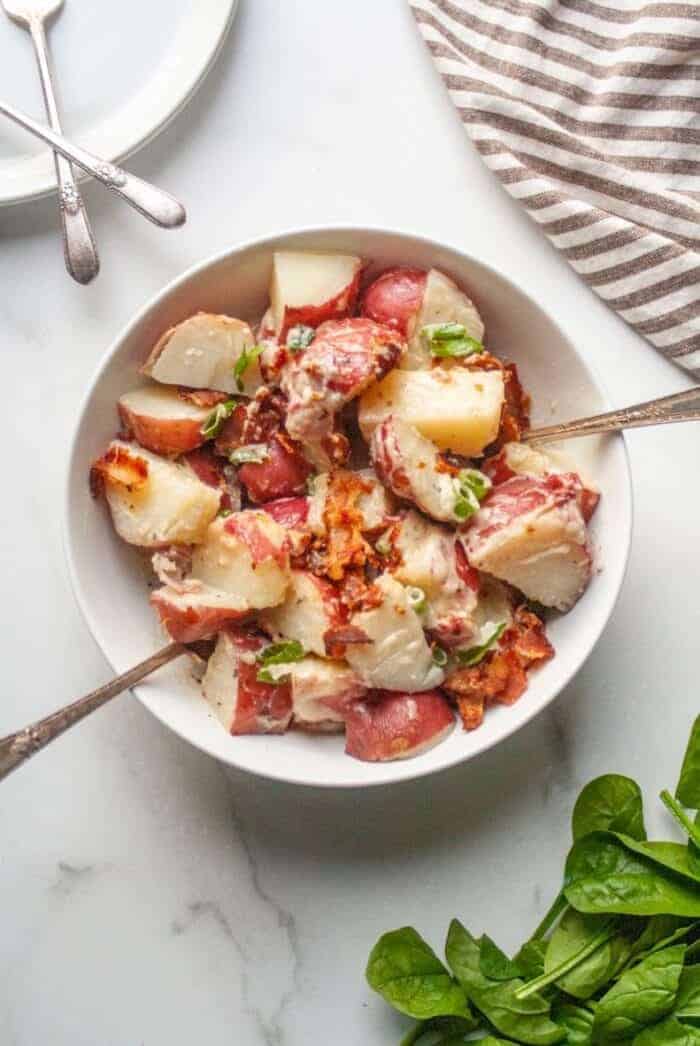 A white bowl filled with Whole30 Potato Salad.