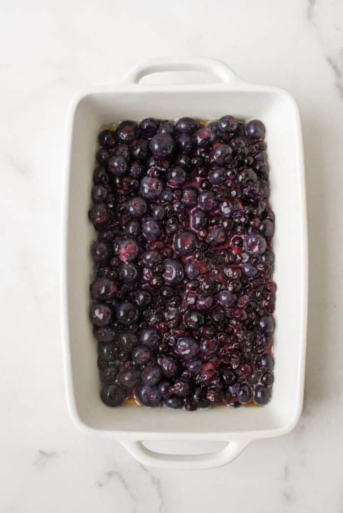 Blueberries in a casserole dish.