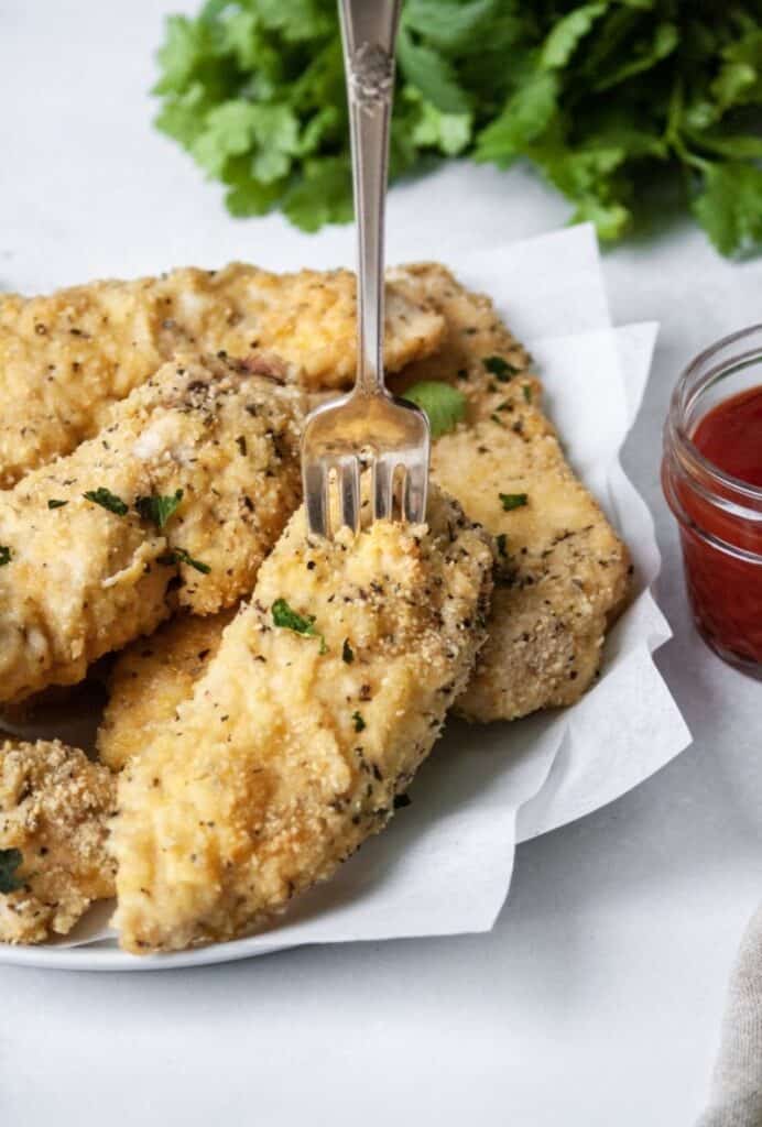Breaded chicken with fork