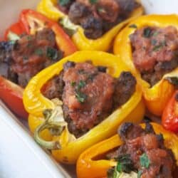 Whole30 taco stuffed peppers in white casserole dish
