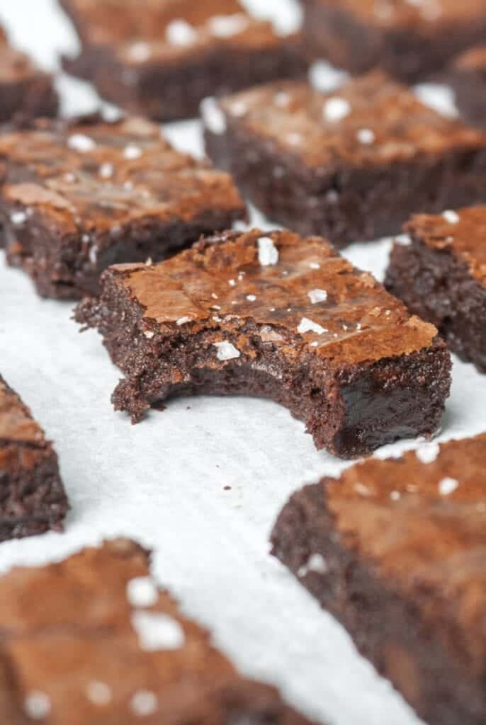 Paleo fudge brownies on a white backdrop.