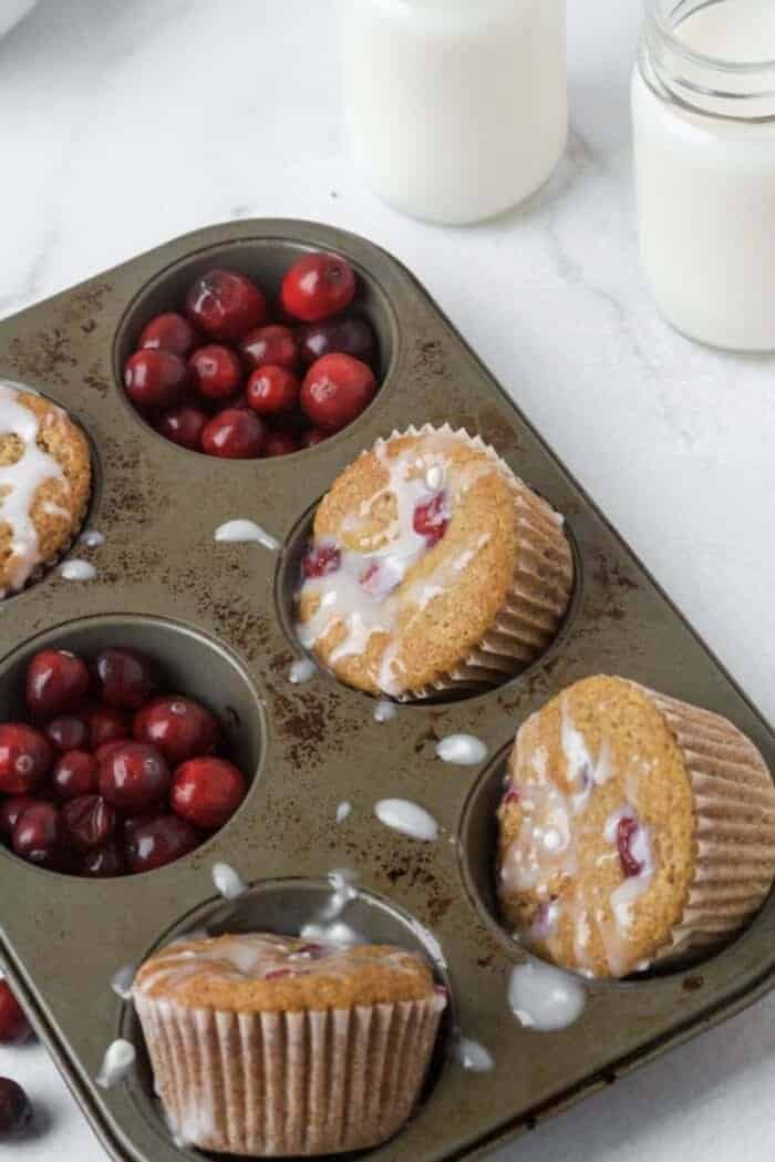Paleo Orange Cranberry muffins in a muffin tray.