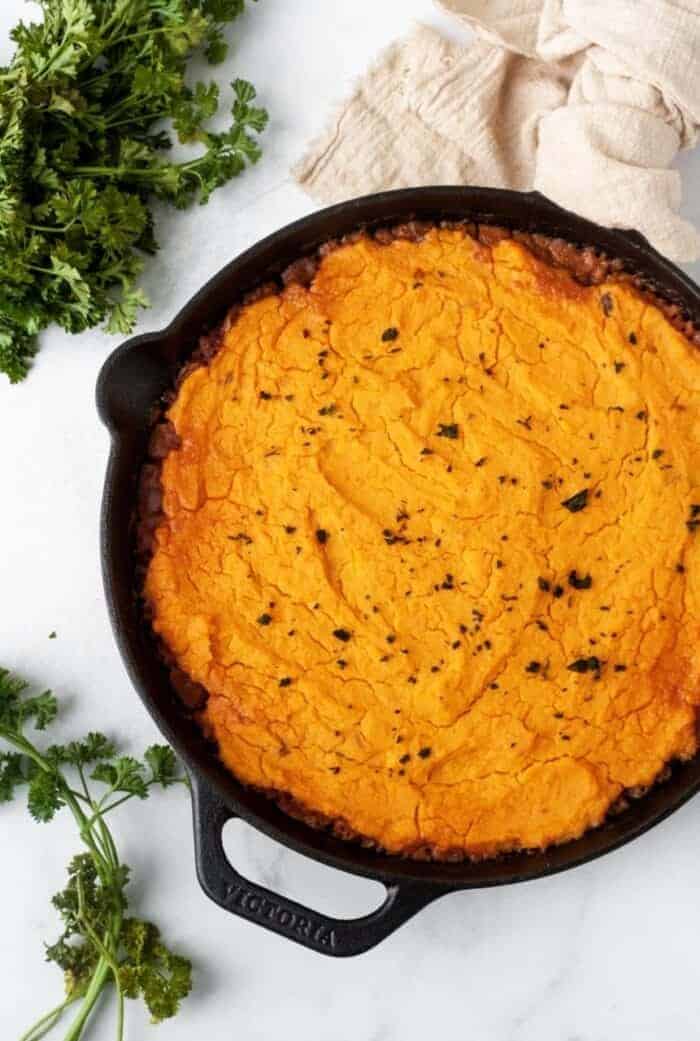 A cast iron skillet filled with Whole30 Shepherd's Pie.