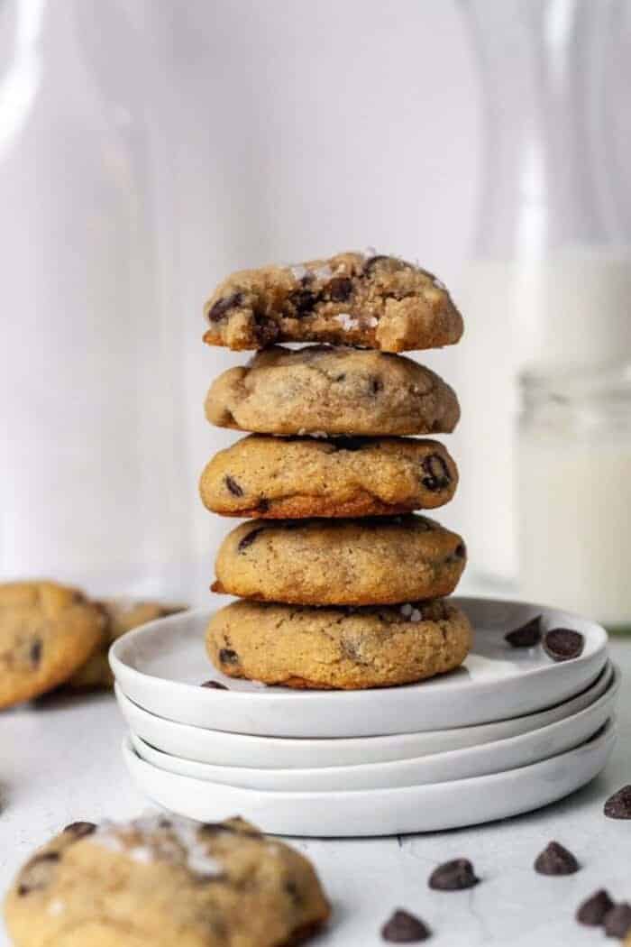 A stack of Paleo chocolate chip cookies on a white plate.