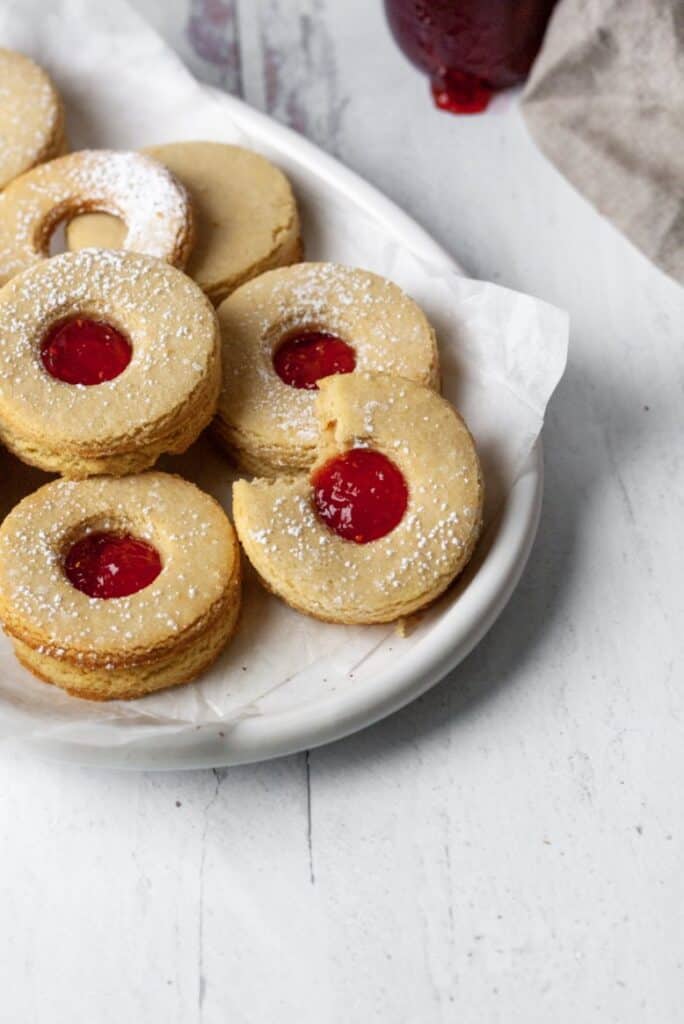 Gluten Free Linzer cookies on a white plate.