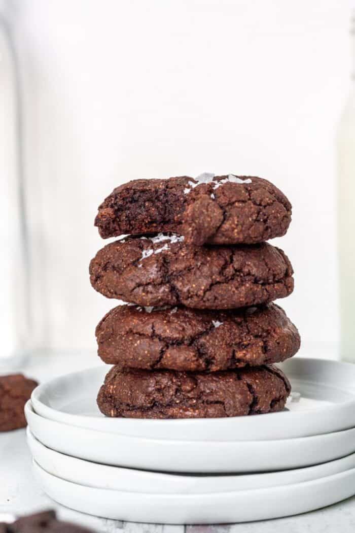 A stack of Paleo Gluten Free Brownie Cookies on a white plate.