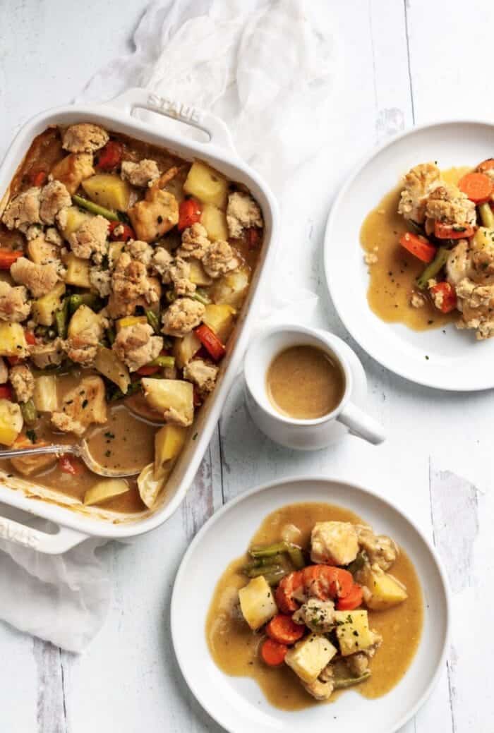 Whole30 chicken pot pie casserole on a white backdrop with Whole30 gravy.