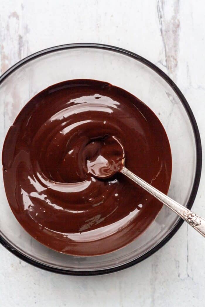 A bowl of melted dark chocolate.