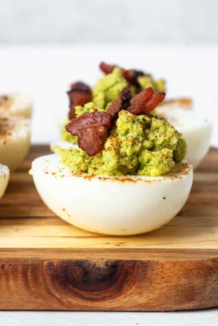 Paleo Deviled Eggs with avocado and bacon.