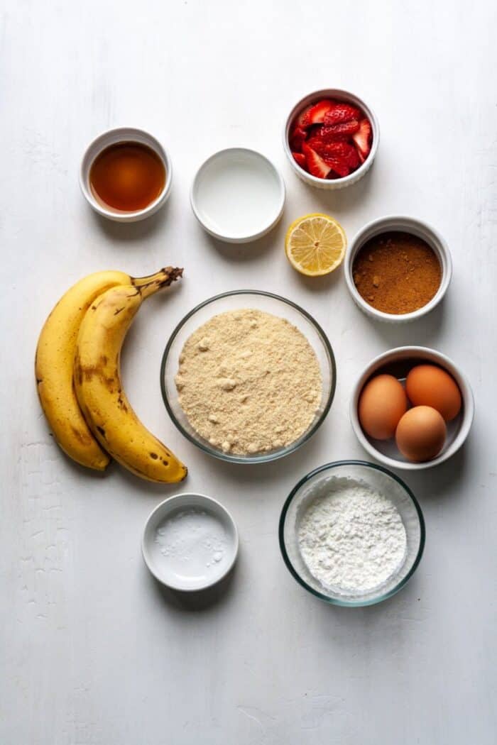 The ingredients needed for strawberry banana bread.