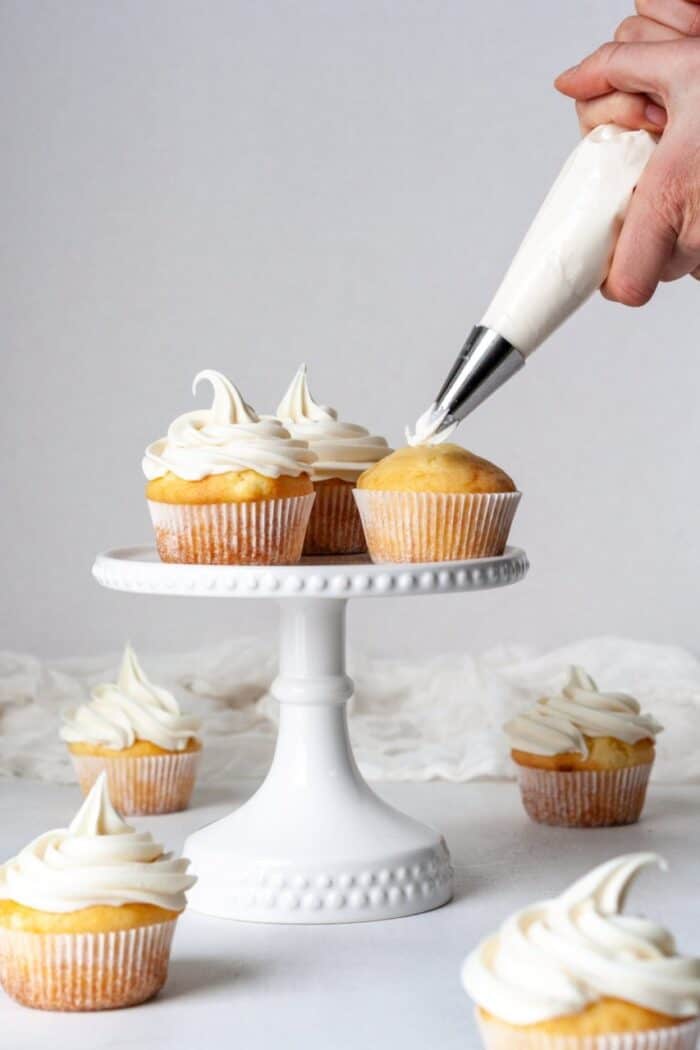 Paleo Vanilla cupcakes frosted with paleo frosting.
