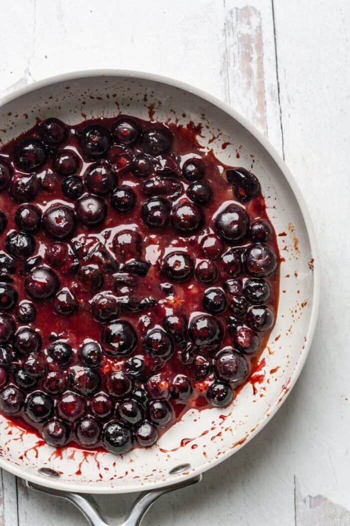 A skillet filled with Vegan blueberry jam.