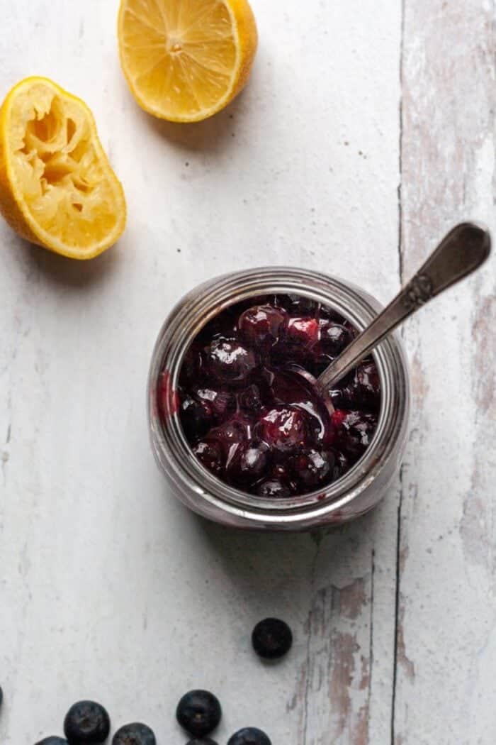 A jar filled with blueberry Vegan jam.