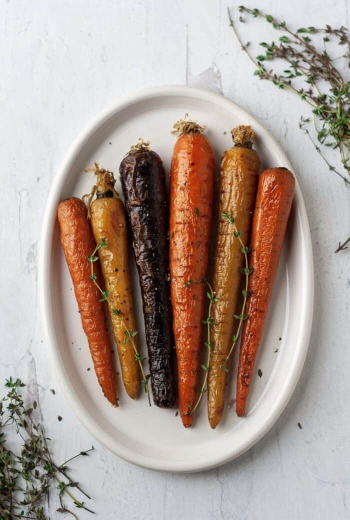Air fryer carrots on a white plate.