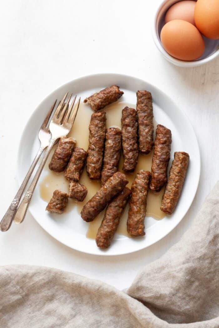 Air fryer sausage on a white plate
