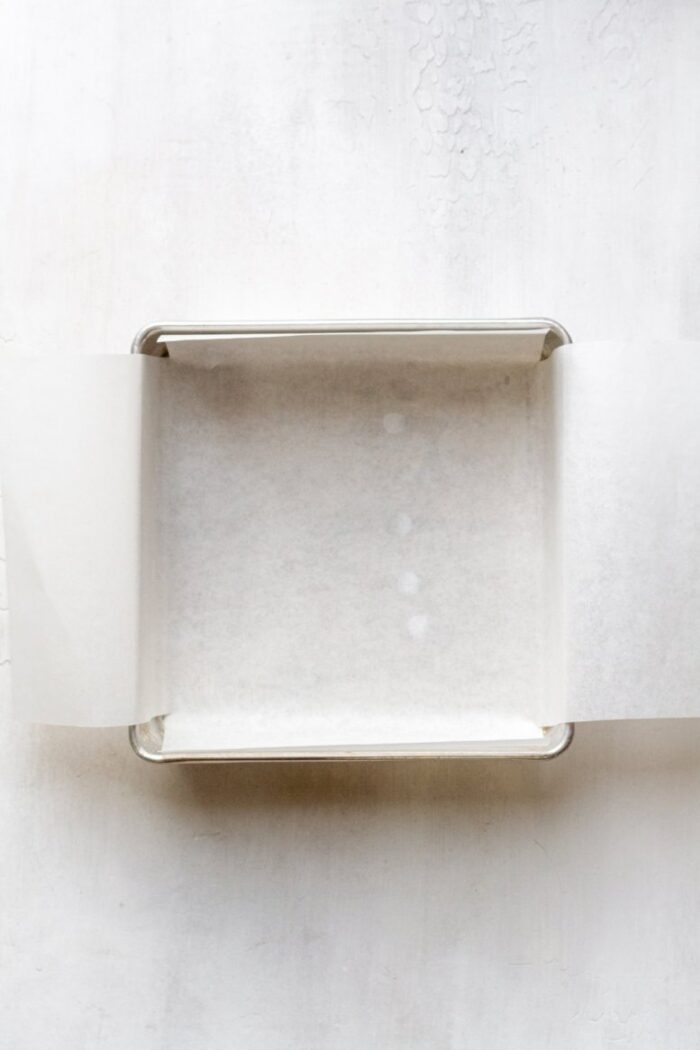 A baking pan with parchment paper.