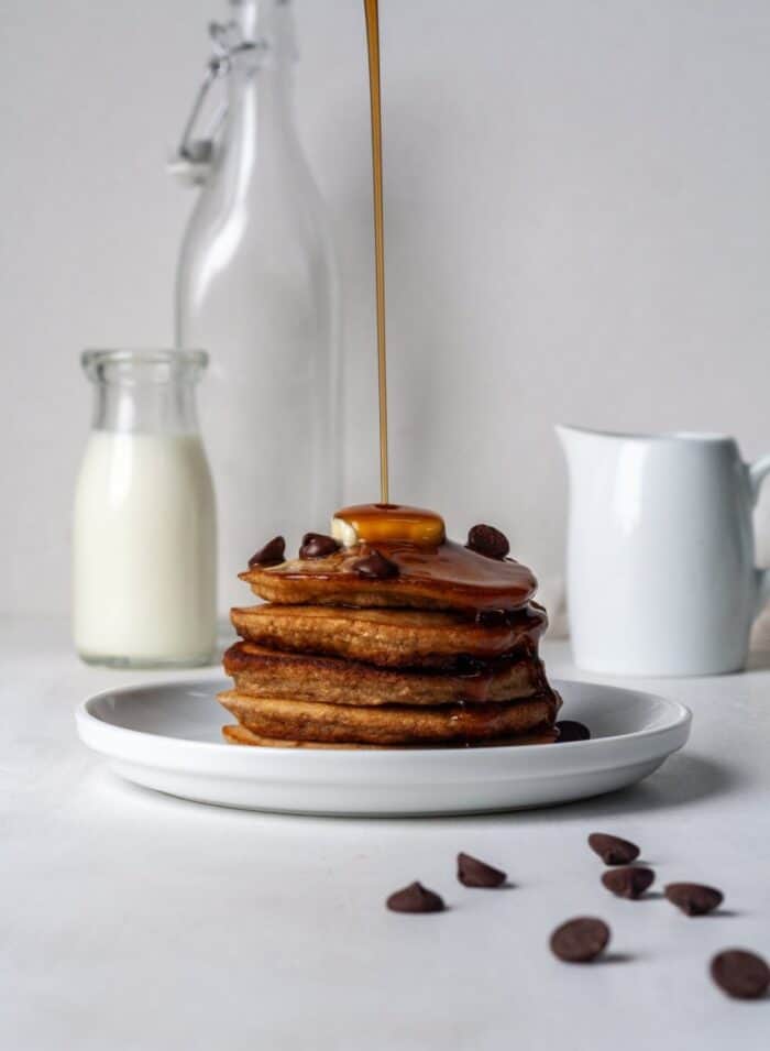 Fluffy Paleo pancakes with chocolate chips and maple syrup