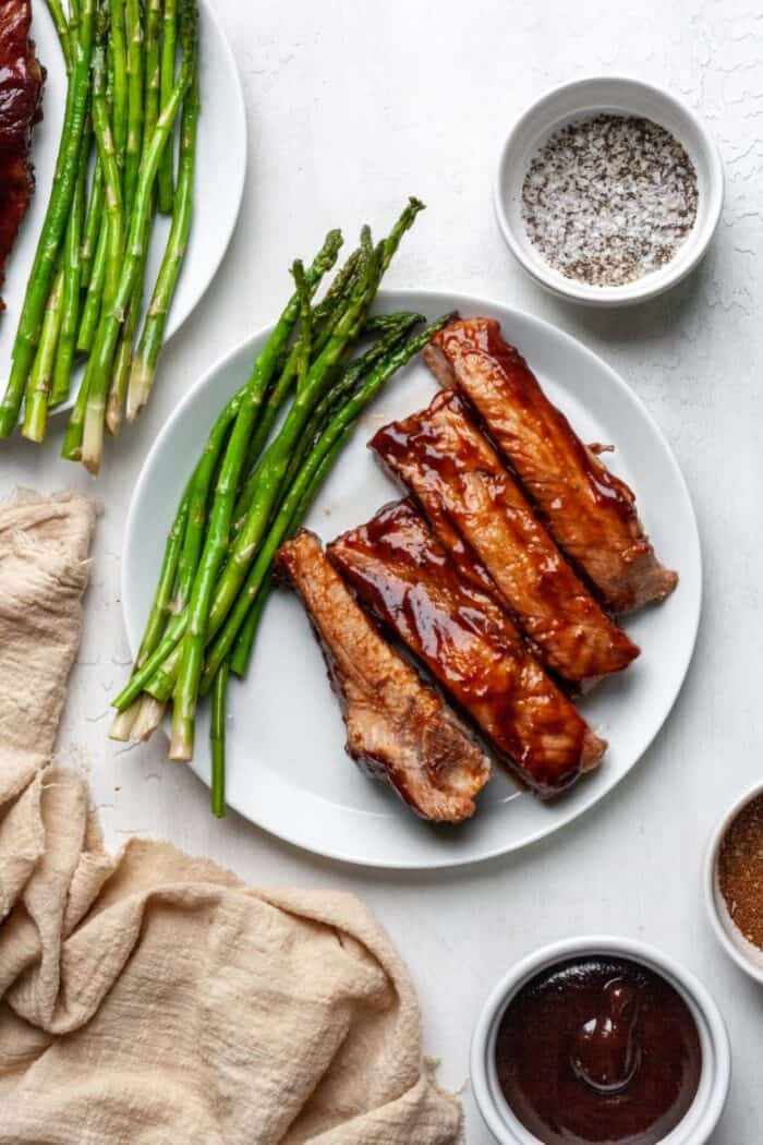 BBQ pork ribs on a white plate.