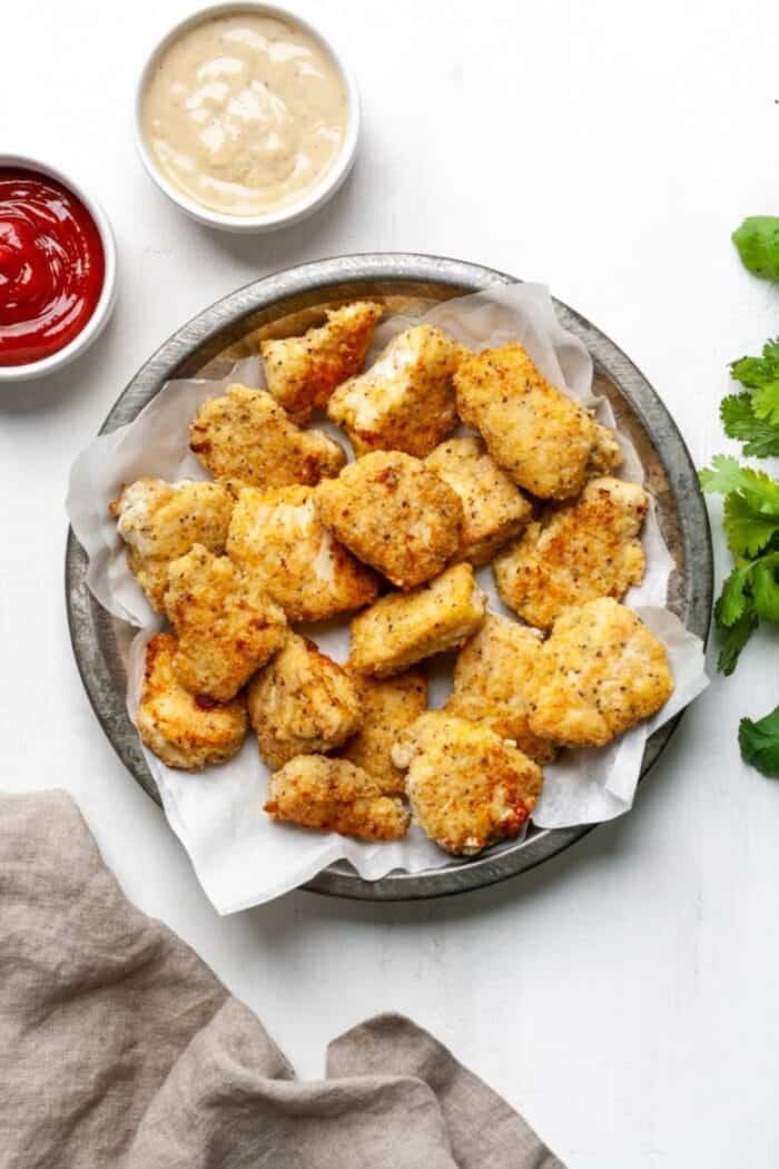 Whole30 chicken nuggets with Whole30 ketchup and garlic aioli