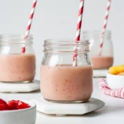 Glass with strawberry pineapple smoothie