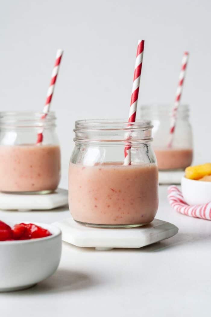 Glass with strawberry pineapple smoothie