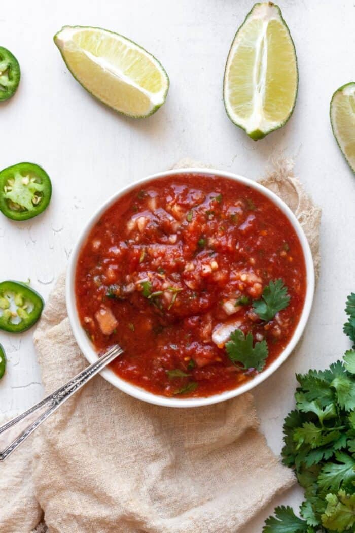 Salsa in white bowl with lime
