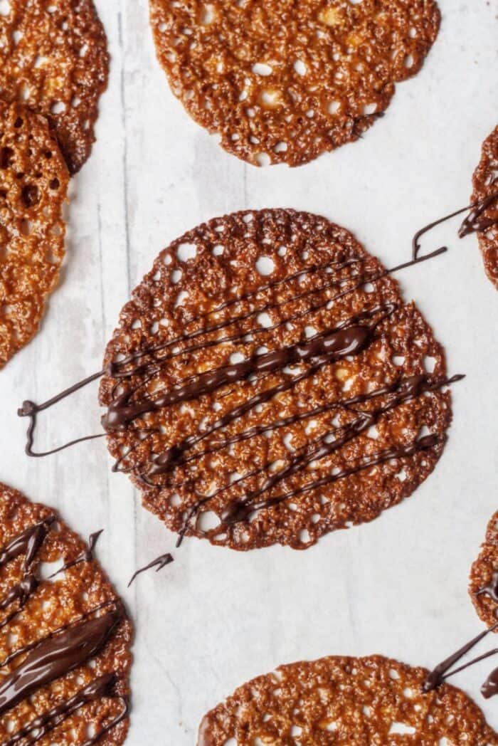 Crispy almond flour lace cookies with chocolate drizzle