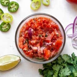 Whole30 salsa in glass bowl with ingredients