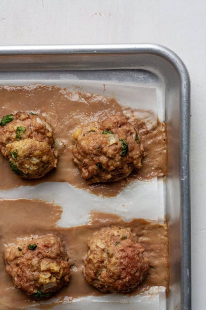 Baked meatballs on pan