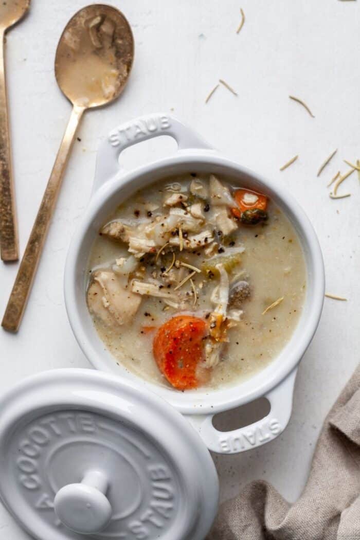 Whole30 chicken soup in white bowl