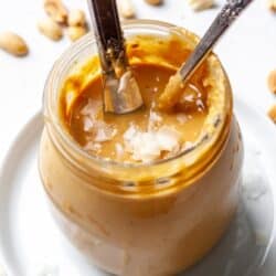 Coconut peanut butter in jar with knife