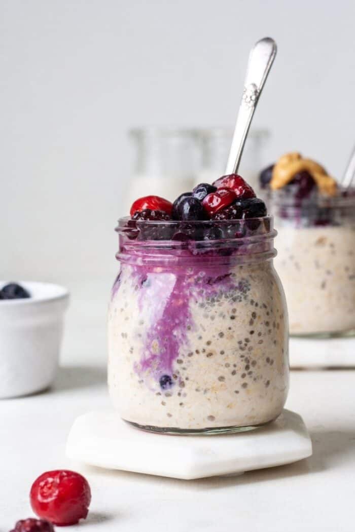 Overnight oats with frozen fruit in glass jar