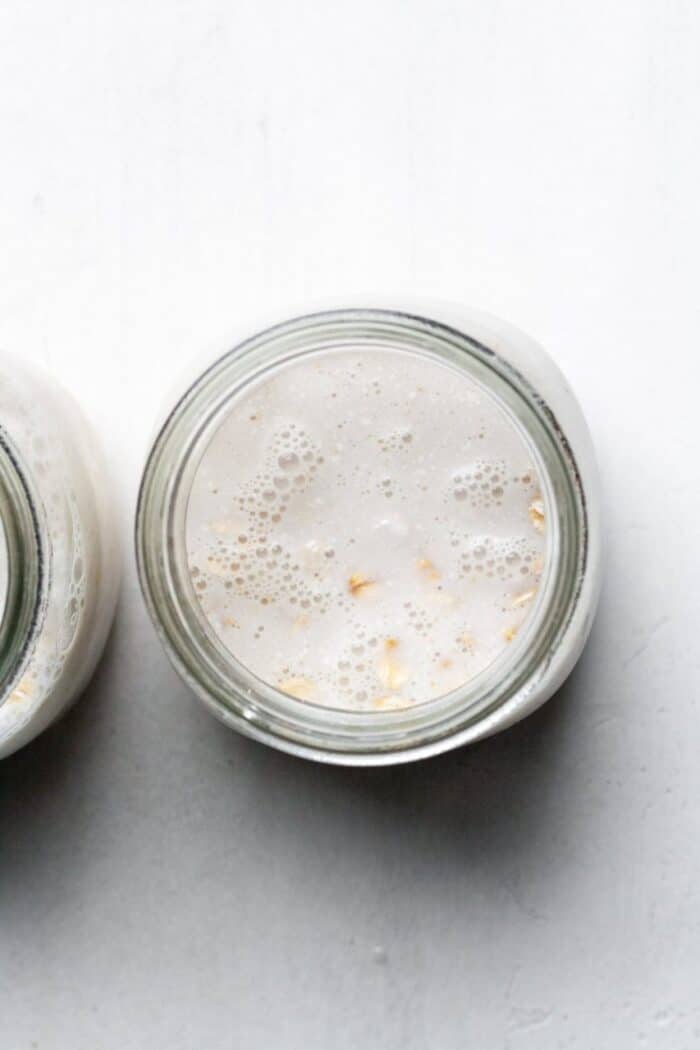 Oats and almond milk in jar