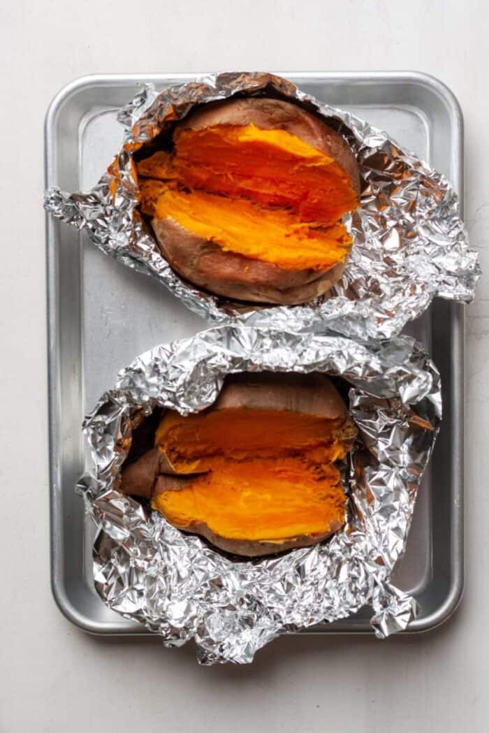 Roasted sweet potatoes on baking pan