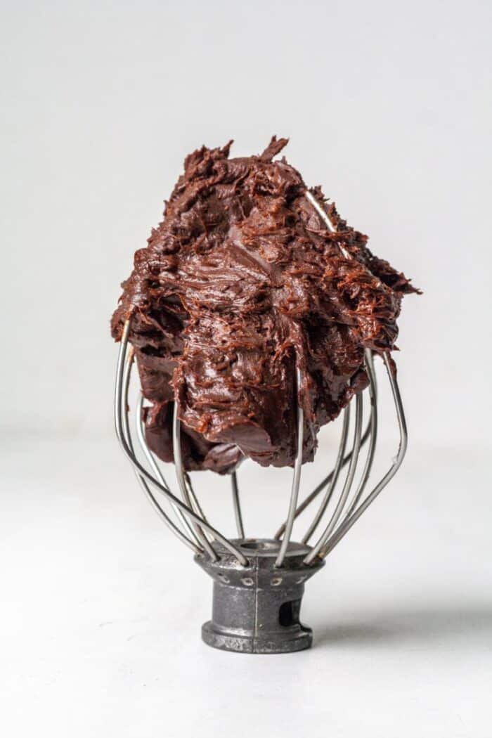 Homemade paleo chocolate frosting in whisk