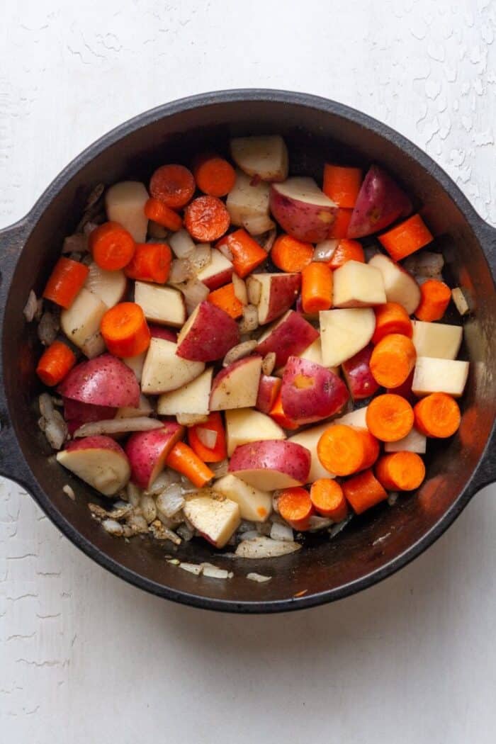 Carrots, potatoes and onions in Dutch oven
