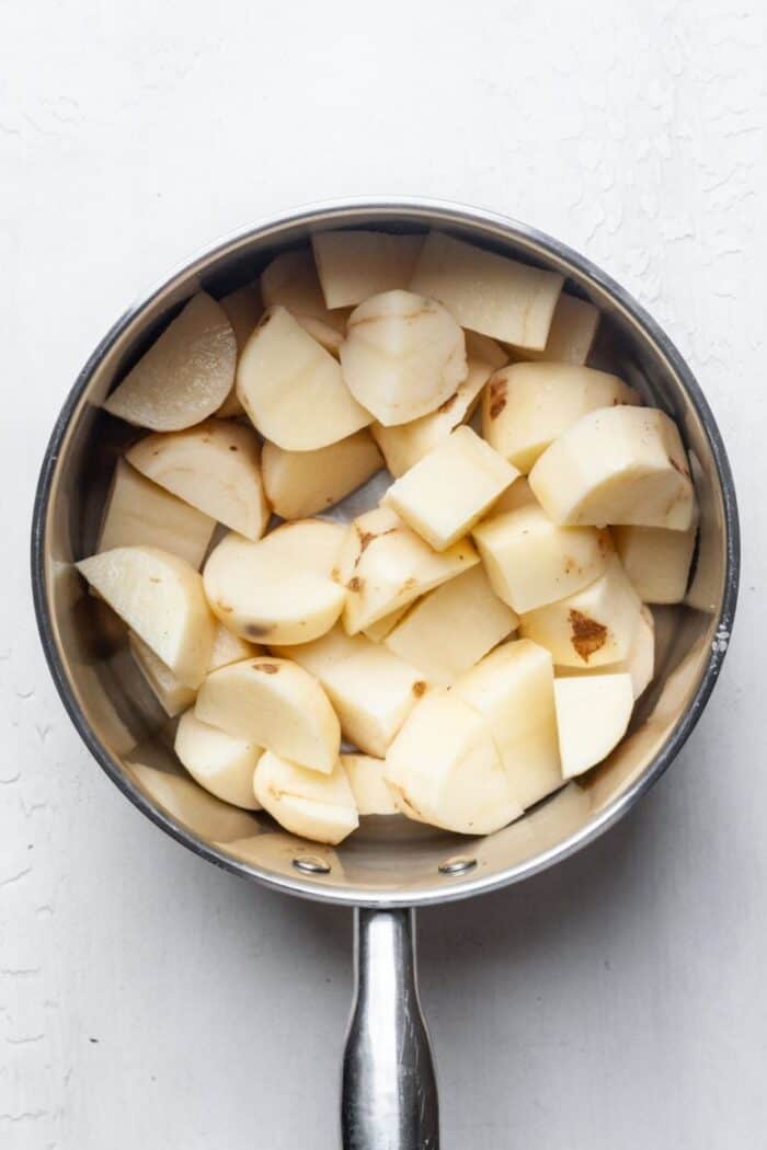 Cubed potatoes in pot