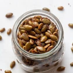 Roasted pepitas seeds in a jar