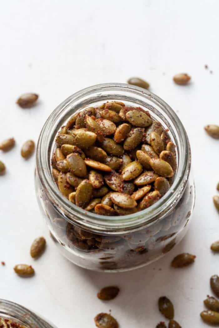 Roasted pepitas seeds in a jar