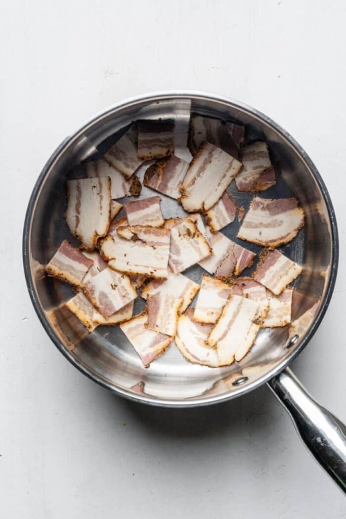 Sliced bacon in pot