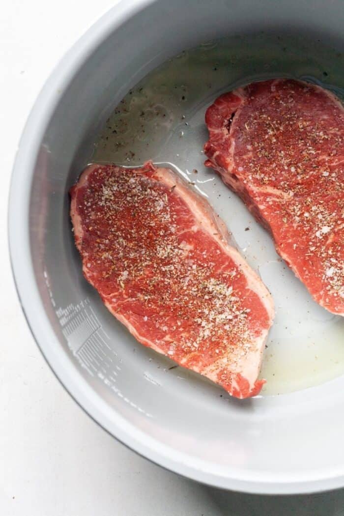 Raw steak in pressure cooker