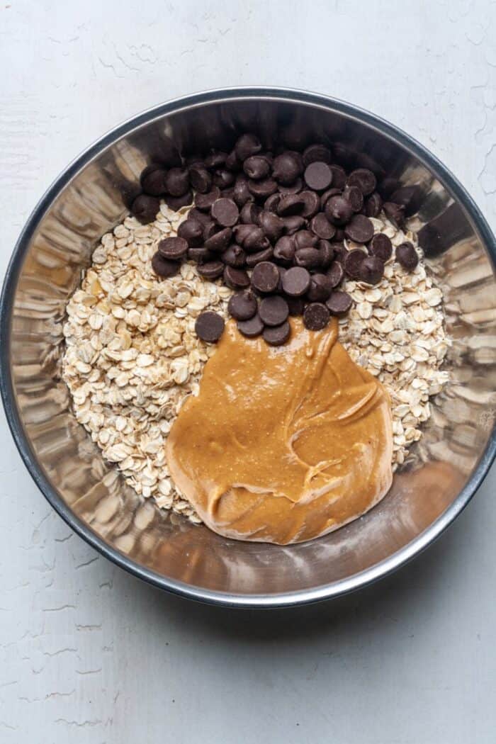 Peanut butter, oatmeal and chocolate chips in bowl