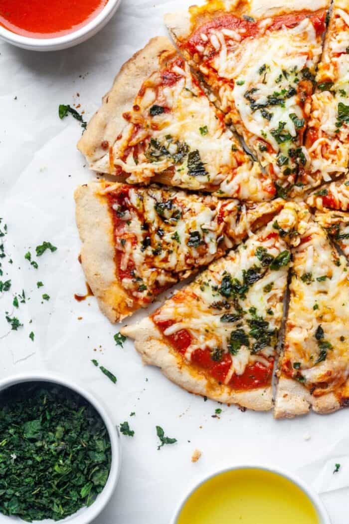 Paleo pizza with dairy free cheese and basil