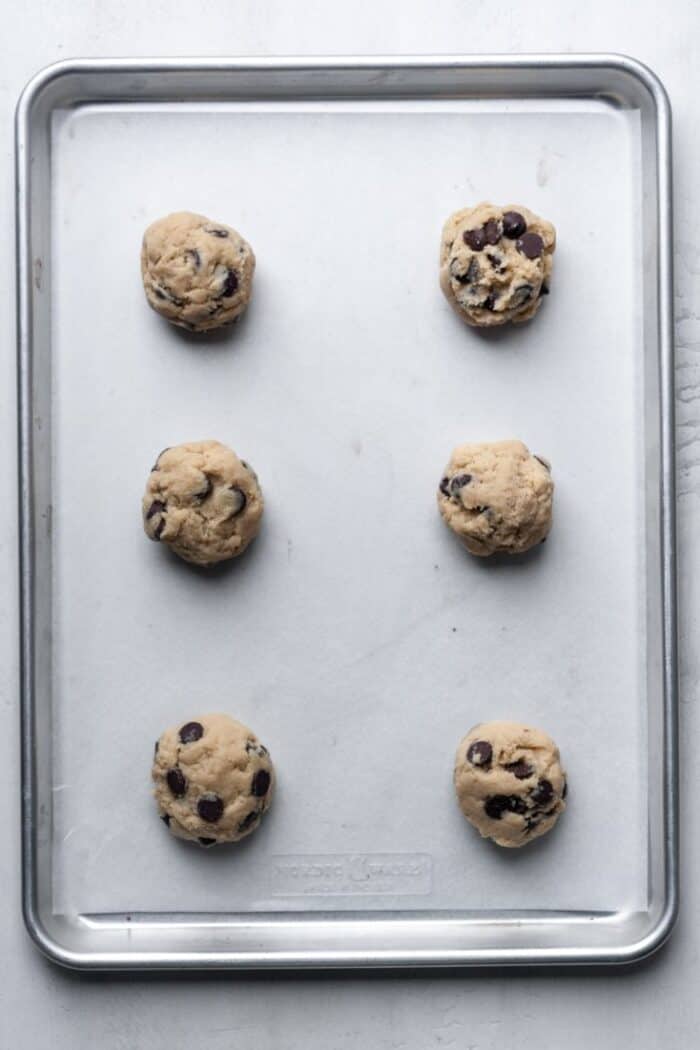 Balls of cookie dough on pan