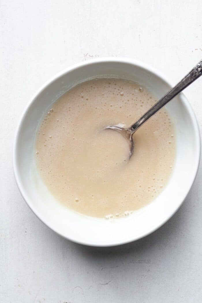Creamy vanilla glaze in bowl
