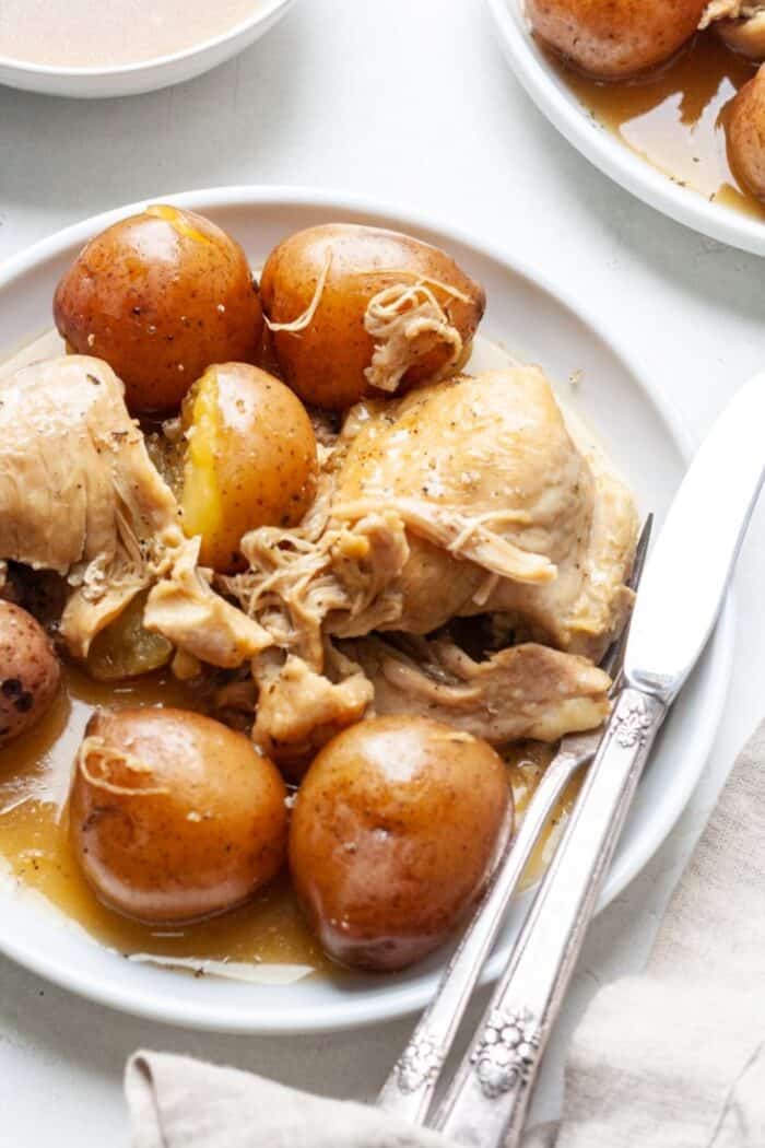Instant Pot chicken thighs with potatoes on plate