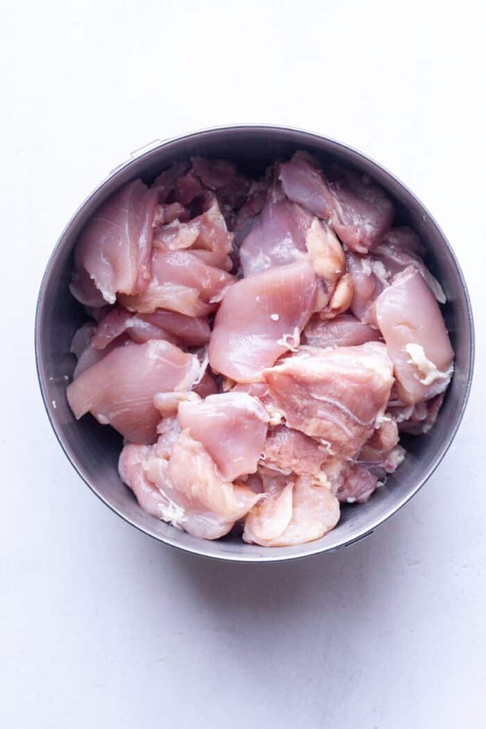 Diced chicken thighs in bowl