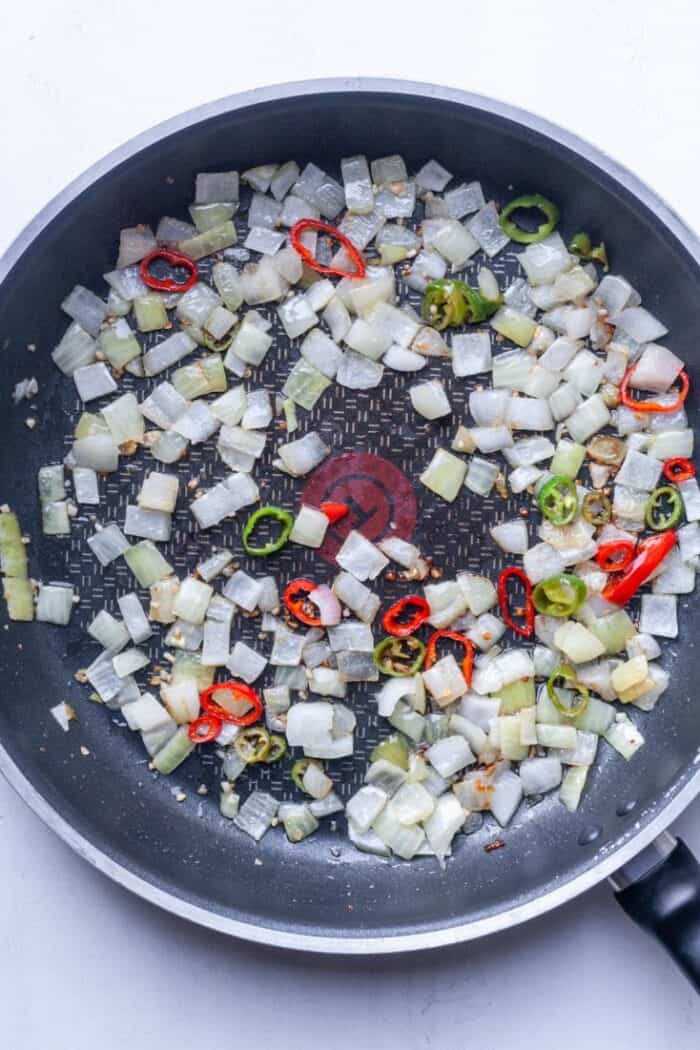 Onions and peppers in skillet