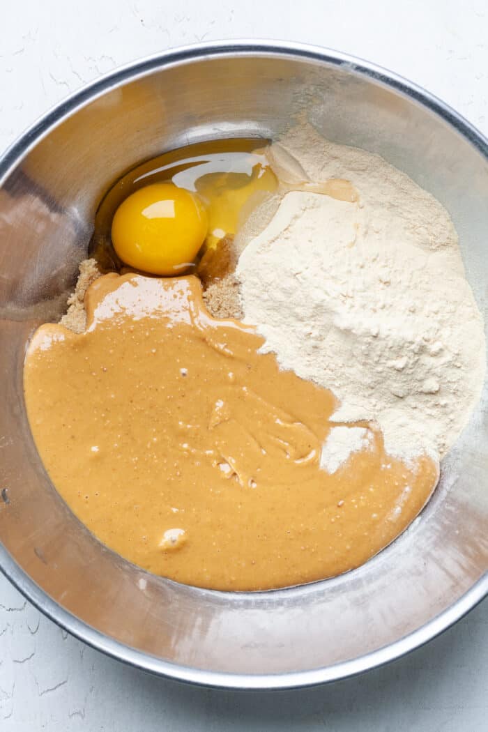 Peanut butter and egg in mixing bowl