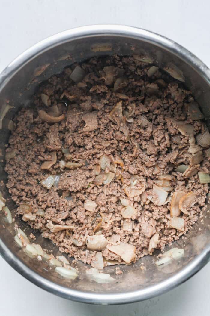 Ground beef and onions in pot